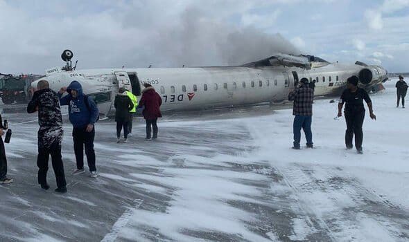 Delta plane flips upside-down at Toronto airport, injuring 8