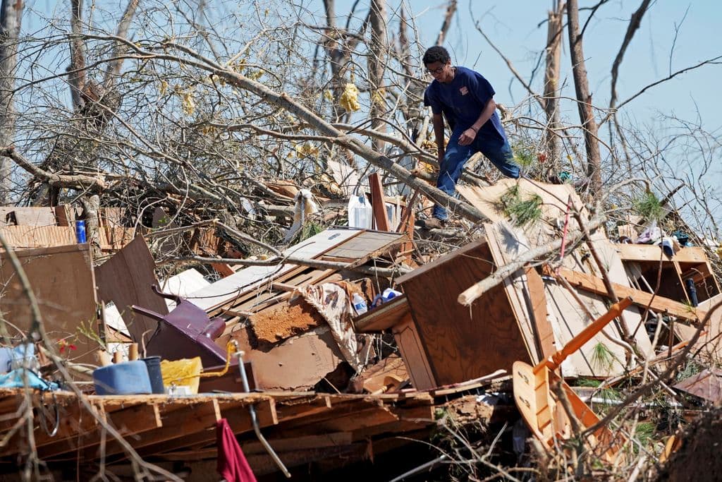 Tornadoes, winds and wildfires leave 39 dead across the US