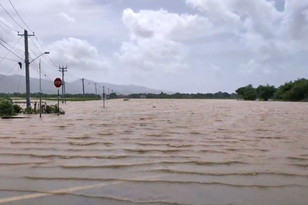 Hazy skies, windy conditions and flood alert continue
