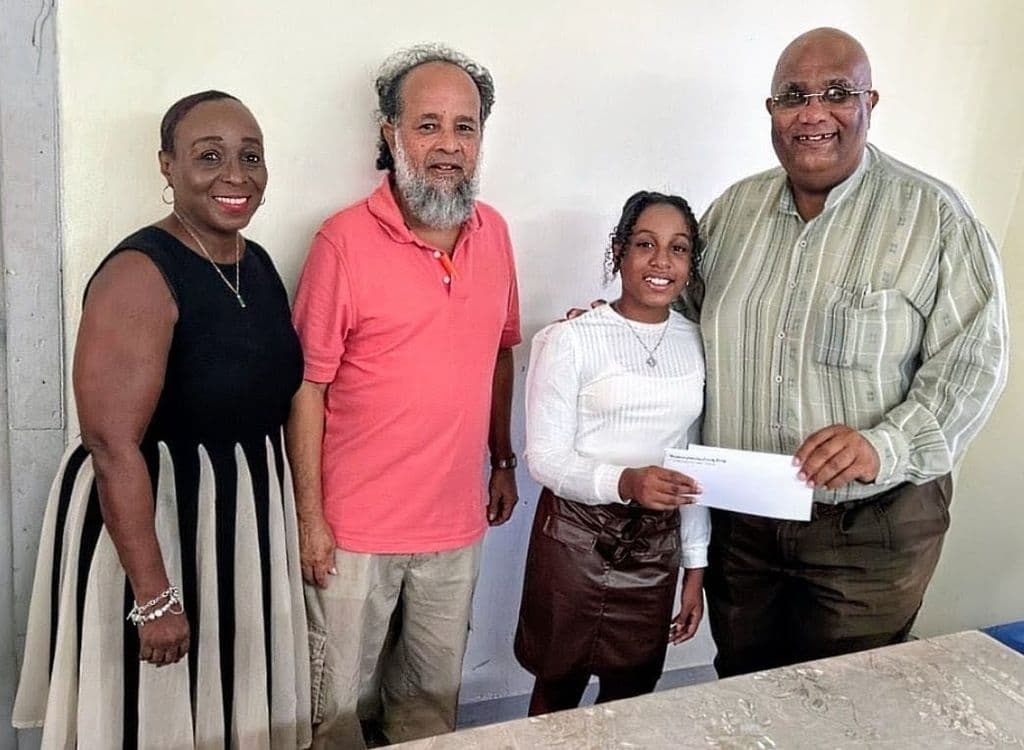 Woodbrook Fellowship Friendly Society honours SEA success of juvenile member