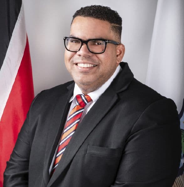 Flooding eases as Maraval residents remove refrigerator stuck in drain