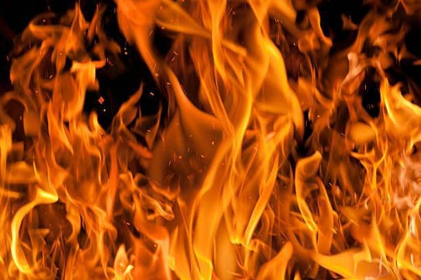 Fire destroys vehicles, damages home