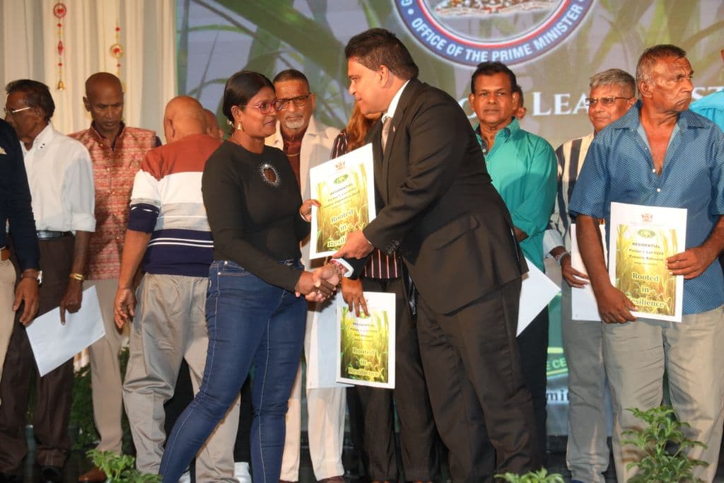 Govt distributes 110 residential leases to former Caroni workers