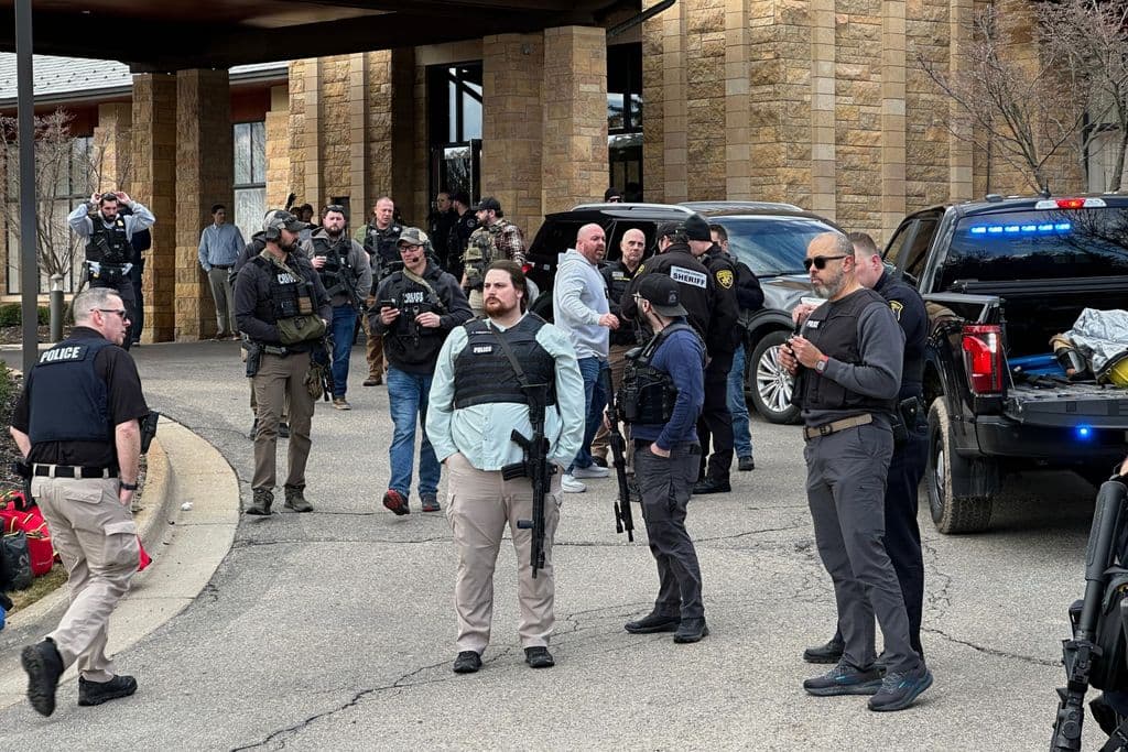 Armed man rammed vehicle into Michigan synagogue and was fatally shot by security, AP source says