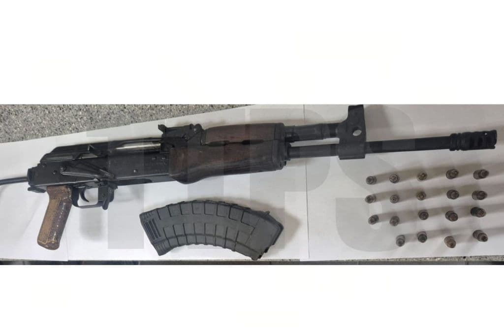 Woman held after high-powered rifle found in vehicle