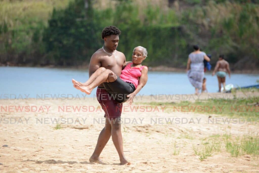 Teen carries granny to the beach