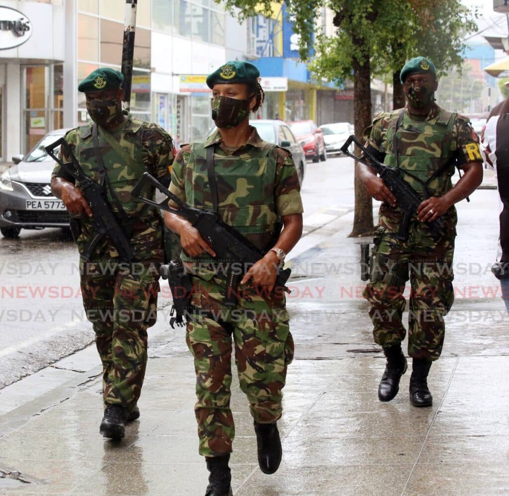 Soldier among three held with guns, ammo