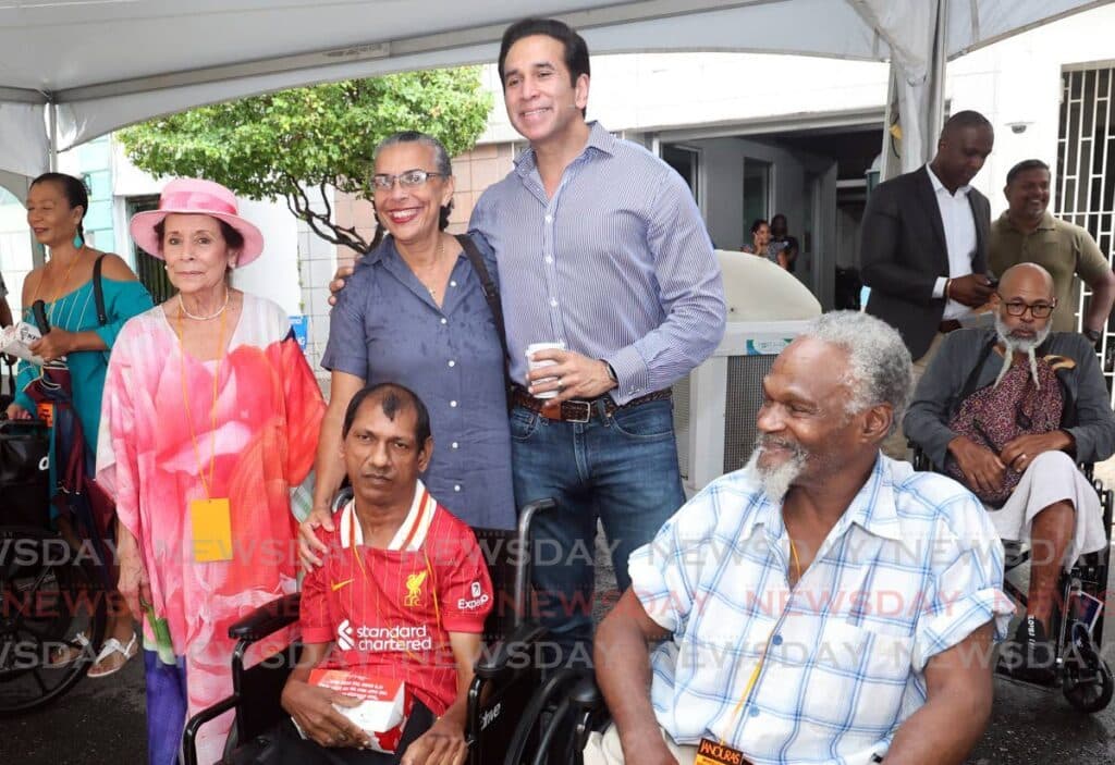 Janoura family distributes 190 wheelchairs in Port of Spain