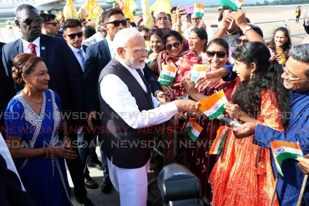 Joyful greeting for India's PM at Piarco Airport