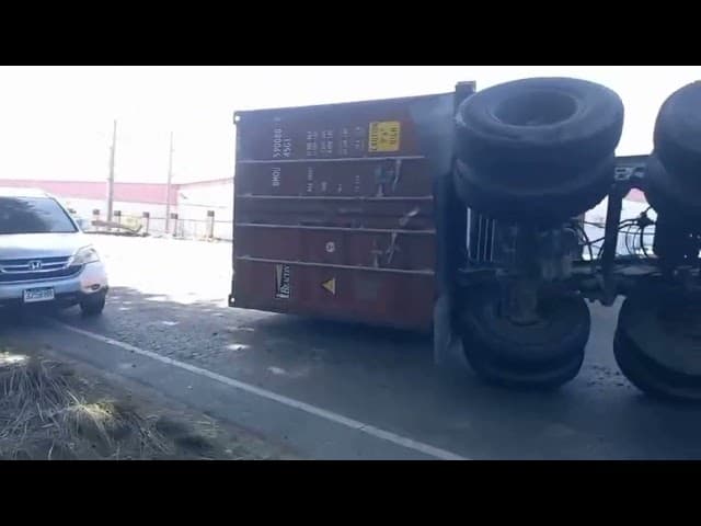 WATCH: Overturned trailer truck causing traffic delays in Central Village