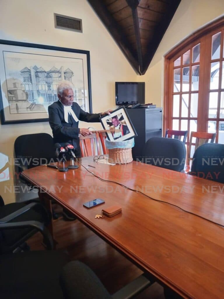 Israel Khan 'destroys' CJ Archie's framed photo