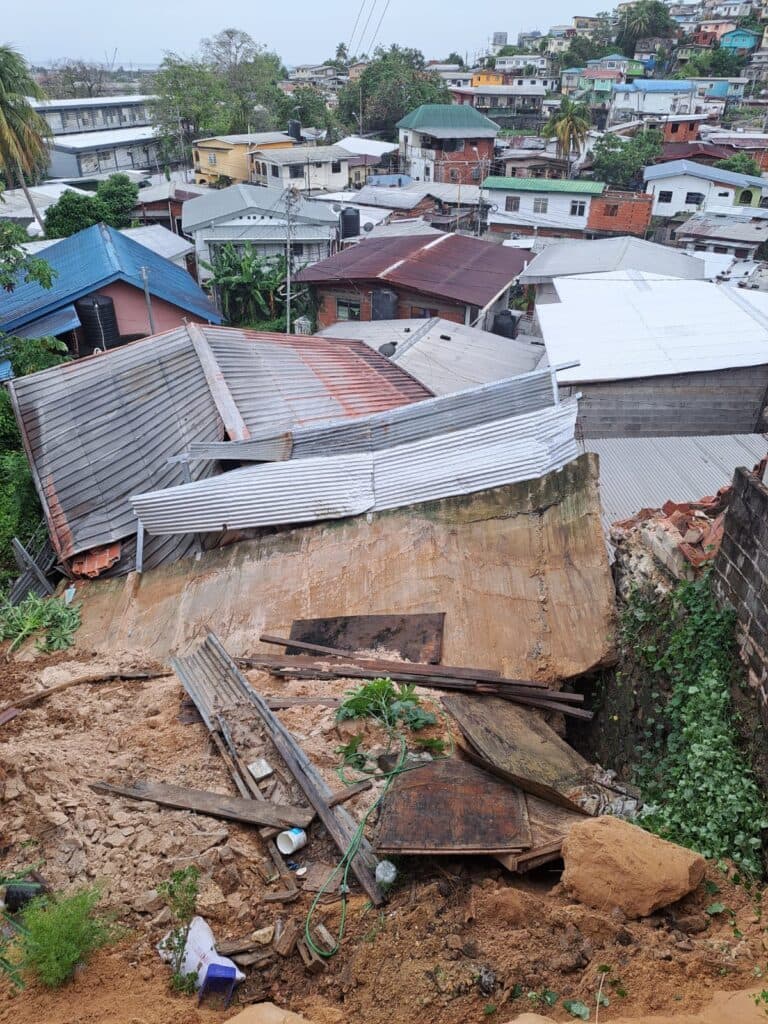 Collapsed wall crushes house in Laventille