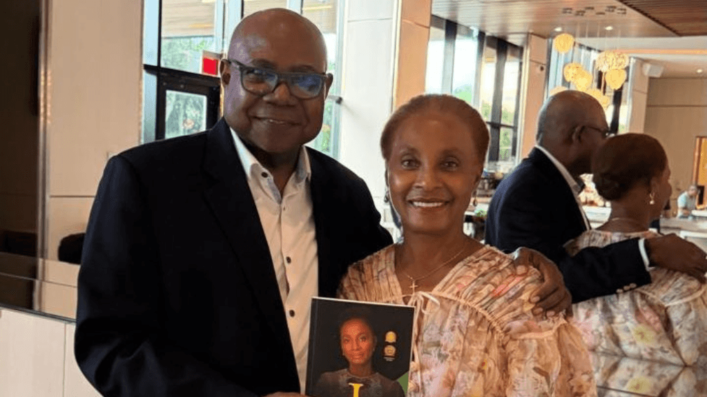 Dr Patricia Smith presents Tourism Minister with copy of her book ‘I Persist’