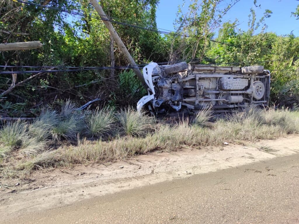 Cops escape with minor injuries after service vehicle overturns in Trelawny