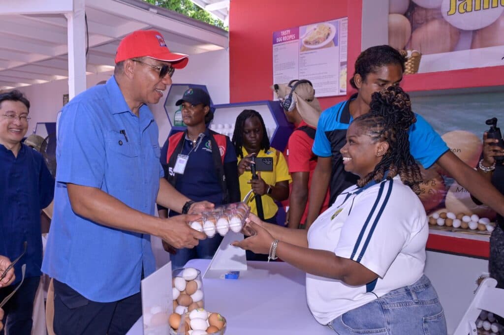 Holness lauds farmers for embracing technology and research
